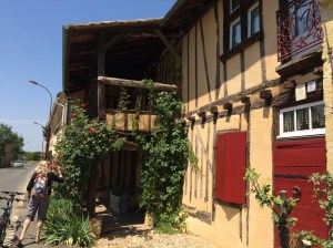 14th century country house with outside porch and trough.