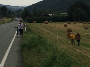 Judith meeting pilgrims, including a Muslim from Niger, after developing a puncture.