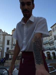 Nunu Rafael, with his mother's name, Claudia, tattooed on his left arm.