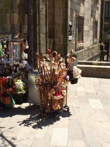 All manner of walking sticks are used by pilgrims.  Seem odd having them on sale at the end point - these are presumably just souvenirs.