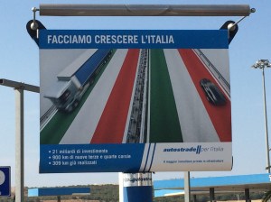 Hoarding at Apricena advertising private infrastructure investor 'Autostrade per Italia's plans to invest Euros 21 bn on 900 kms of new motorways.