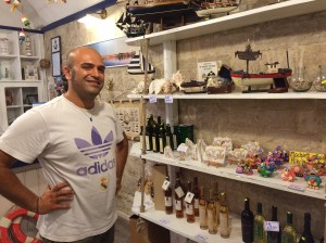 Sandro, the friendly and helpful owner of the Giudeca souvenir shop - interested in helping us with our quest.