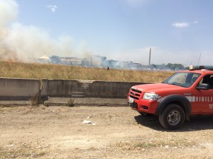 The Fire Brigade battling to control a fire in a field on the outskirts of the city.
